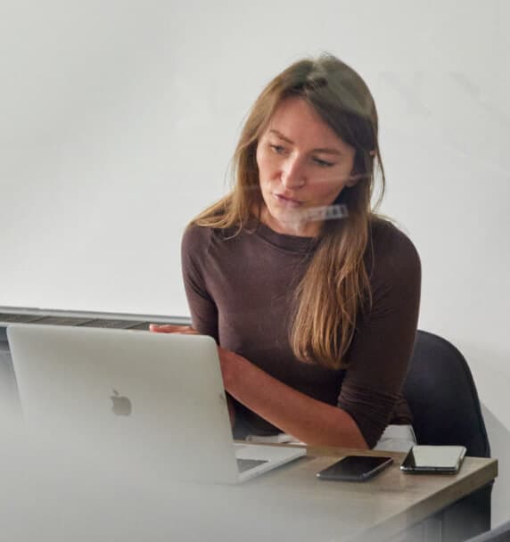 A woman working on a laptop
